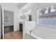 Bathroom with a soaking tub, vanity with a mirror, and a window with a view at 2038 Mincey Ter, North Port, FL 34286