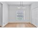 Bright dining room with a window and a light fixture, next to a closet at 2038 Mincey Ter, North Port, FL 34286