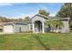 Attractive single-story home features a manicured lawn, two-car garage, and a welcoming entrance at 2038 Mincey Ter, North Port, FL 34286