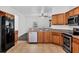 Bright kitchen with stainless steel appliances and wood cabinetry offers great style and functionality at 2038 Mincey Ter, North Port, FL 34286