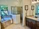 Well-appointed bathroom featuring a soaking tub, walk-in shower, and dual vanities at 20806 Valprato Ct, Venice, FL 34293