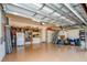Two-car garage with epoxy flooring, storage shelving, and overhead garage door at 20806 Valprato Ct, Venice, FL 34293