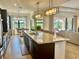 Well-designed kitchen with a large island, stainless steel appliances, and an open layout for easy entertaining at 20806 Valprato Ct, Venice, FL 34293