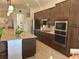 Spacious kitchen with granite countertops, stainless appliances, and ample cabinet space at 20806 Valprato Ct, Venice, FL 34293