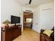 Inviting living room featuring an open doorway and a view into another living space at 20806 Valprato Ct, Venice, FL 34293