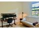 Home office featuring a modern desk setup and comfortable seating area at 20806 Valprato Ct, Venice, FL 34293