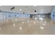 Expansive ballroom with polished floors, perfect for hosting large events and celebrations at 222 Como Dr, Venice, FL 34285