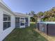 Backyard with an above-ground pool and access to the home's screened-in lanai at 2450 Sahara Ln, North Port, FL 34286