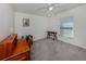 Bright bedroom with a ceiling fan, wood desk and natural light from the window at 2450 Sahara Ln, North Port, FL 34286