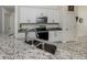 Updated kitchen showcasing granite countertops, stainless steel appliances, and bright white cabinets at 2450 Sahara Ln, North Port, FL 34286