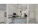 Bright open kitchen featuring granite countertops, white cabinets and stainless steel appliances at 2450 Sahara Ln, North Port, FL 34286