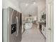 Contemporary kitchen featuring stainless appliances, granite counters and white cabinetry at 2450 Sahara Ln, North Port, FL 34286