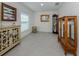 Spacious living room with ample natural light, neutral paint and tile floors at 2450 Sahara Ln, North Port, FL 34286