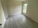 Bright bedroom featuring neutral walls and tile floors at 2643 Orchard Cir, North Port, FL 34288
