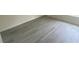 Close-up on bedroom flooring with white trim at 2643 Orchard Cir, North Port, FL 34288