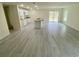 Spacious living room featuring tile floors, recessed lighting, and sliding door access to the backyard at 2643 Orchard Cir, North Port, FL 34288