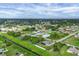 Expansive community aerial view showcases the neighborhood's layout and green spaces at 2694 Hopwood Rd, North Port, FL 34287