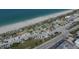 An aerial view of a public beach with parking, a sport court, a covered shelter, and restrooms at 2694 Hopwood Rd, North Port, FL 34287