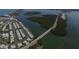 Aerial view of waterfront homes situated along a serene river, showcasing a tranquil community and natural beauty at 2694 Hopwood Rd, North Port, FL 34287
