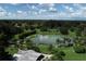 Community features a pond with a sandy beach at 2694 Hopwood Rd, North Port, FL 34287