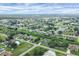 Wide aerial view of the community showing numerous homes and lush surroundings at 2694 Hopwood Rd, North Port, FL 34287