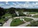 Aerial view of entrance with mature landscaping at 2694 Hopwood Rd, North Port, FL 34287