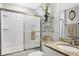 Neat bathroom featuring a shower-tub combination, vanity with granite countertops, and storage shelf at 2694 Hopwood Rd, North Port, FL 34287