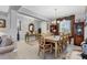 Formal dining room features decorative chairs, neutral colors, and lots of natural light at 2694 Hopwood Rd, North Port, FL 34287