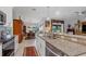 Bright kitchen featuring granite countertops, stainless steel appliances, and open layout to the dining area at 2694 Hopwood Rd, North Port, FL 34287