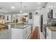 Well-lit kitchen features granite counters, white cabinets, and stainless appliances at 2694 Hopwood Rd, North Port, FL 34287