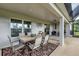Spacious lanai with large table and seating, perfect for outdoor dining and entertaining at 2694 Hopwood Rd, North Port, FL 34287