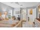 Inviting main bedroom showcasing a seating area, ensuite bathroom, and tranquil atmosphere at 2694 Hopwood Rd, North Port, FL 34287