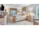 Cozy main bedroom featuring neutral tones, elegant furnishings, and a peaceful ambiance at 2694 Hopwood Rd, North Port, FL 34287