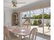 Bright dining area with views of the screened in outdoor area at 325 Fiesole St, Venice, FL 34285
