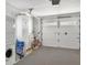 Well-organized garage with washer, dryer, storage, and a decorated garage door at 325 Fiesole St, Venice, FL 34285