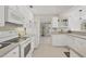 Efficient kitchen features white cabinetry and ample counter space at 325 Fiesole St, Venice, FL 34285