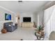 Inviting living room showcasing neutral paint and tile flooring at 325 Fiesole St, Venice, FL 34285