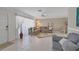 Cozy living room with neutral walls, tile floors, and ample natural light at 325 Fiesole St, Venice, FL 34285