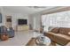 Bright living room featuring tile floors, neutral tones, and lots of natural light at 325 Fiesole St, Venice, FL 34285