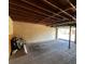 A spacious and unfinished garage with bicycle stored inside and ample storage space at 3641 Longmeadow # 33, Sarasota, FL 34235