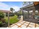 View of the screened-in patio, the back yard and the house next door at 3641 Longmeadow # 33, Sarasota, FL 34235