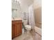 Bathroom with vanity, toilet, shower, and tile flooring at 3691 Parkridge Cir # 201, Sarasota, FL 34243