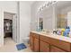 Bathroom with vanity, toilet, shower and walk-in closet at 3691 Parkridge Cir # 201, Sarasota, FL 34243