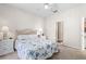 Cozy bedroom featuring neutral paint, carpet, ceiling fan, and ensuite bathroom at 3691 Parkridge Cir # 201, Sarasota, FL 34243