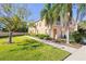 Charming townhome with lush landscaping, mature trees, and a private front porch at 3691 Parkridge Cir # 201, Sarasota, FL 34243