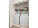 Laundry room equipped with appliances and storage shelving at 3691 Parkridge Cir # 201, Sarasota, FL 34243