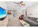 Spacious living room showcases neutral carpeting, comfortable seating, and open layout to the kitchen at 3691 Parkridge Cir # 201, Sarasota, FL 34243