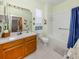 Bathroom featuring a wood vanity and tub with shower at 4123 Cascade Falls Dr, Sarasota, FL 34243