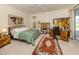 Bright bedroom featuring decorative rug, desk, and unique headboard at 4123 Cascade Falls Dr, Sarasota, FL 34243