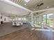 Spacious clubhouse with tables, chairs, and floor-to-ceiling windows providing lots of natural light at 4123 Cascade Falls Dr, Sarasota, FL 34243